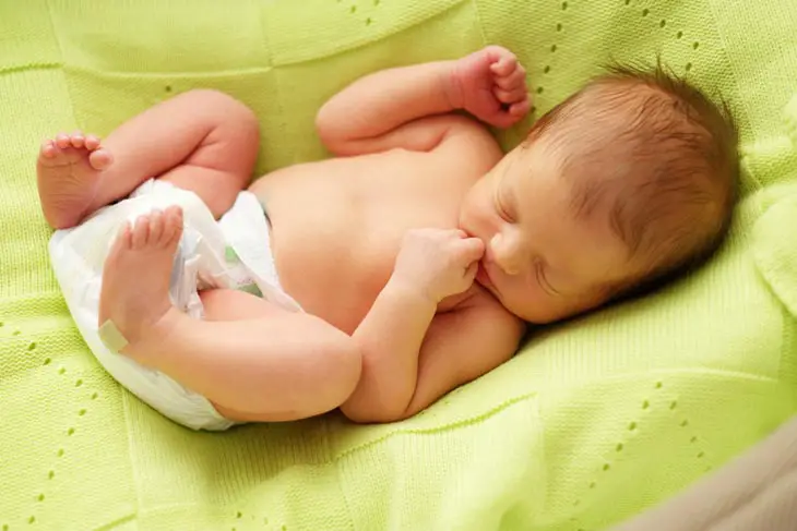 Baby Throwing Legs Up and Down in Sleep