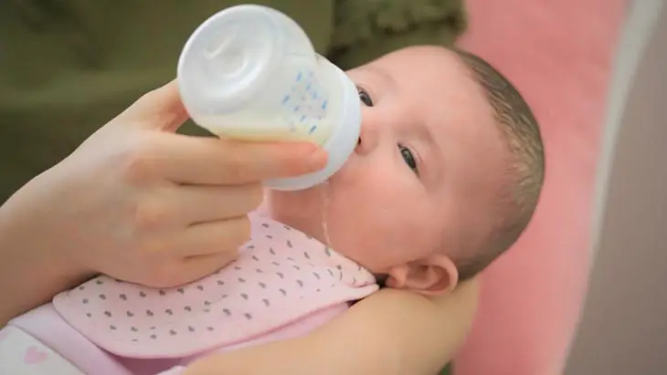 Baby Spits Out Milk While Bottle Feeding