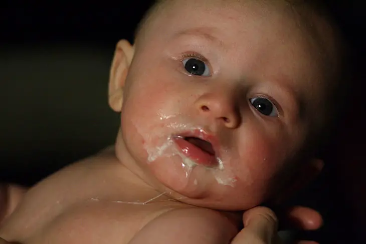 baby spitting up curdled milk should i be concerned