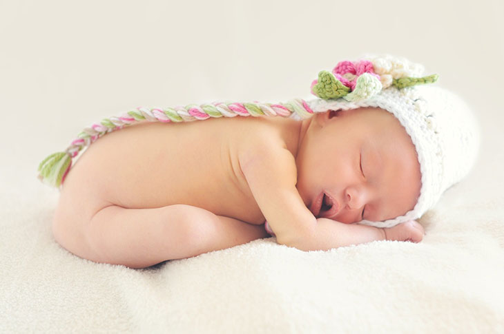 baby sleeping sitting up folded in half